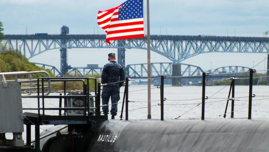 a submariner waving a us flag
